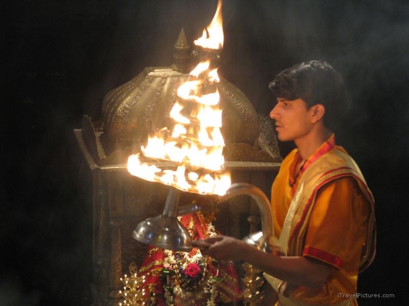 Varanasi evening ceremony fire man