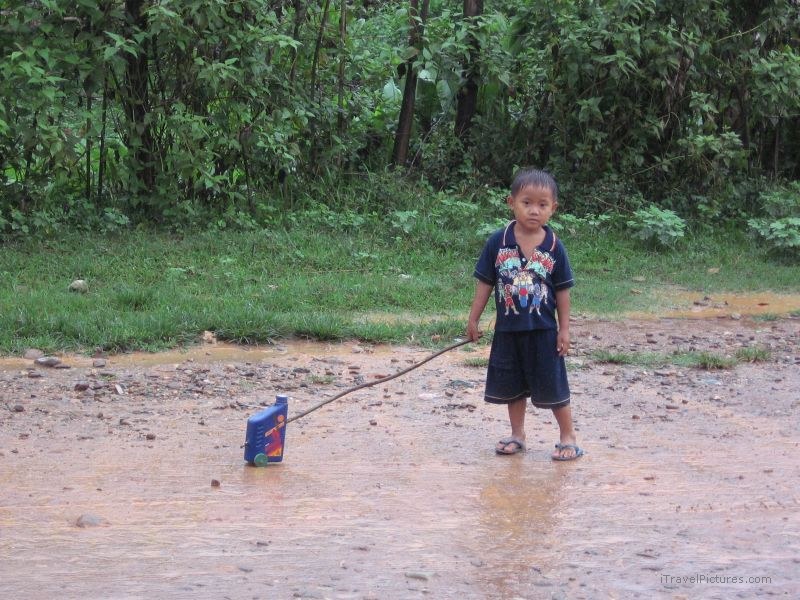 boy toy road rain