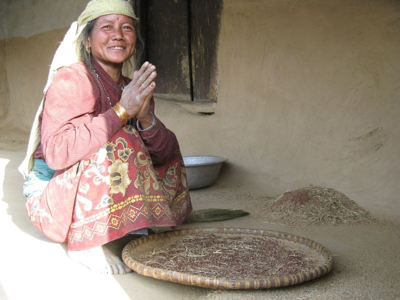 Chaliss woman sorting grain namaste