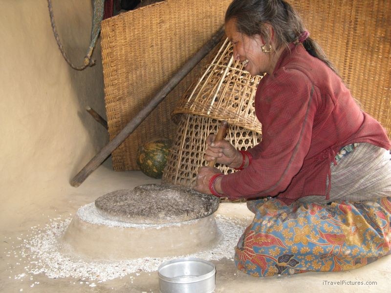 Chaliss woman grinding grain