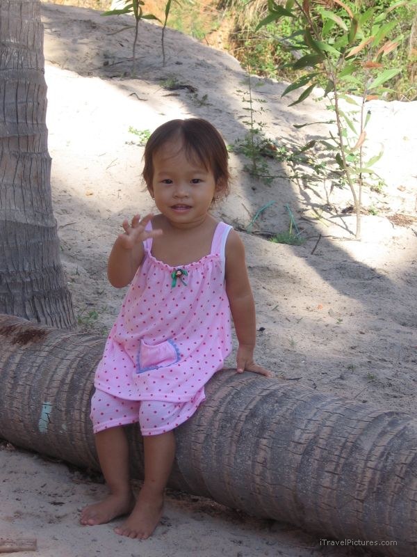 young girl small tree sitting pink